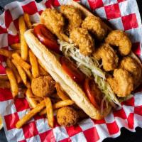 Shrimp Po Boy · Classic Louisiana Po Boy Sandwich with fried Shrimp, shredded lettuce, tomato and homemade a...