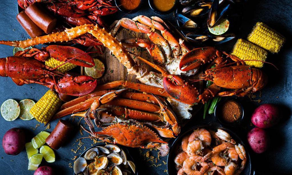 Seafood Family Feast · ALL OF OUR SEAFOOD: 2 Whole Lobsters, 1 King Crab Leg, 1 Dungeness Crab, 1 Cluster of Snow Crab Legs, 1 Blue Crab, 1 lb Shrimp, 1 lb Mussels, 1 lb Clams, and 1 lb Crawfish + Lots of Corns, Potato, and Sausages