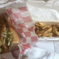 Fried Catfish Po-Boy (Large) · All Po'-boys dressed with lettuce, tomatoes, pickles, and mayonnaise. Add Fries & Drink for ...