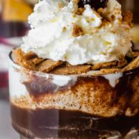 Campfire  · Graham cookie crumbles, chocolate fudge sauce, and gooey smoked marshmallow, over our rich, ...