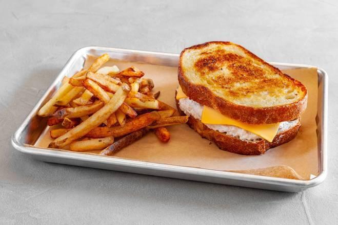 Tuna Melt Sandwich · We start with our classic tuna salad and cover it with white American cheese, then melt it all together between two toasted slices of Macrina''s sourdough loaf. A diner staple. Served with fries.