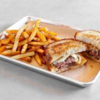 Patty Melt · A diner staple. Seasoned 1/3 lb. 100% beef patty topped with melted white American cheese an...