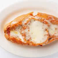 Eggplant Parm · Breaded eggplant with cheese and sauce on a locally baked roll.