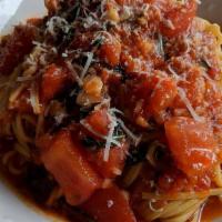 Taglierini Pomodoro · Vegetarian. Thin-ribbon pasta, fresh tomatoes, garlic and basil.