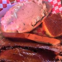 Brisket Platter · Half a pound of our smoky brisket, with cornbread and choice of one side.