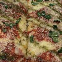 Grandma Pizza · Square crust, cheese on bottom sauce spotted on top, parm cheese , basil and pesto