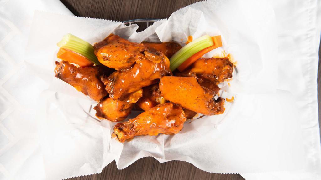 Chicken Wings · Bone-in or boneless wings hand tossed in your choice of sauce. Served with celery, carrot sticks and ranch or blue cheese on the side.