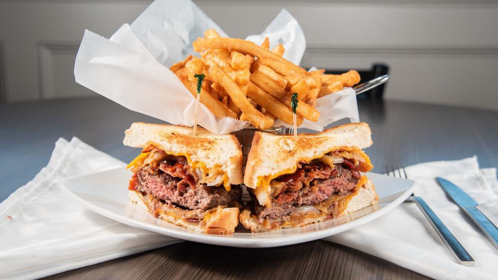 Rhody O Burger · Cheddar cheese, bacon, onion rings and BBQ sauce served on grilled Texas toast.