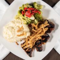 Tenderloin Steak Tips · 10 ounces of marinated tenderloin steak tips served with your choice of potato and vegetable.