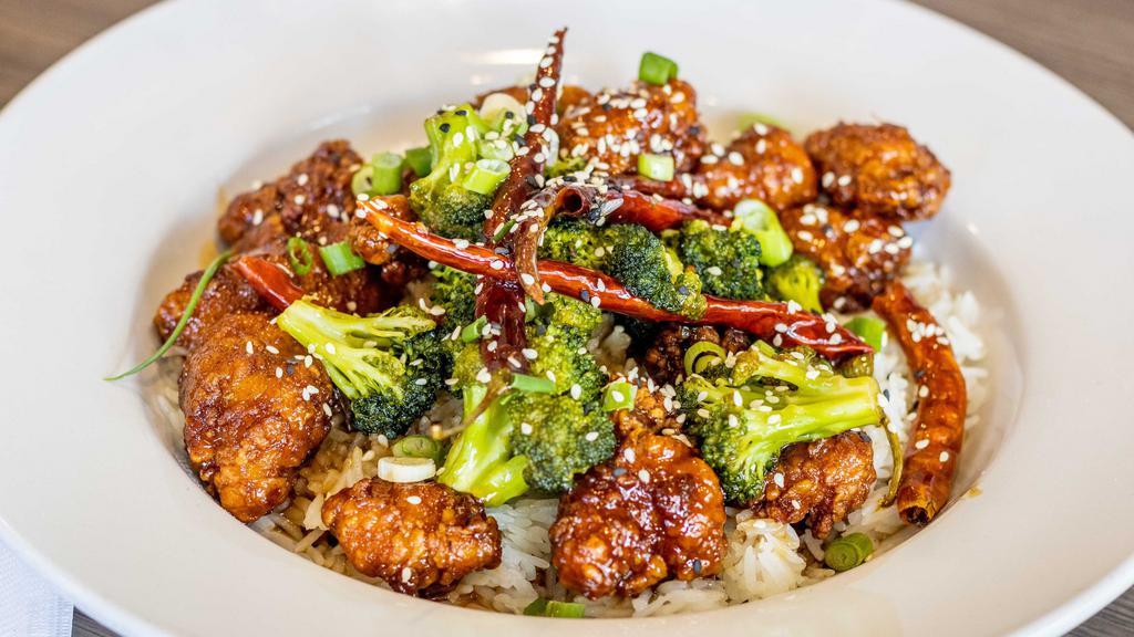 General Tso'S Chicken · Fried Chicken Pieces Tossed in our own sweet and spicy General Tso's sauce.  Mixed with Broccoli, Sesame Seeds, Scallions, and Dried Chili Peppers.  Served over Jasmine rice.
