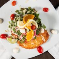 Chicken Milanese · Panko breaded chicken, pan sautéed and topped with baby arugula, cherry tomatoes, fresh mozz...