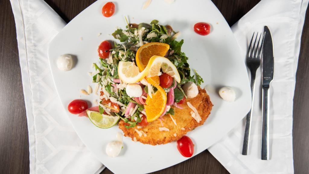 Chicken Milanese · Panko breaded chicken, pan sautéed and topped with baby arugula, cherry tomatoes, fresh mozzarella, pickled red onions and parmesan cheese tossed in a balsamic vinaigrette.