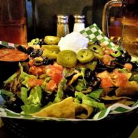 Traditional Pub Nachos · Tortilla chips, seasoned beef or chicken and melted jack-cheddar cheese topped with shredded...