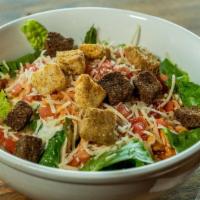Angry Chicken Caesar Salad · Crisp romaine lettuce drizzled with Caesar dressing and topped with oven-baked chicken tosse...