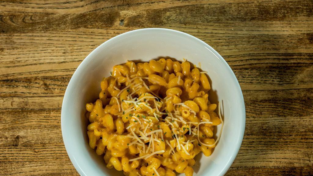 Pub Mac & Cheese · Cavatappi pasta tossed in a creamy smoked cheddar cheese sauce then topped with shredded parmesan cheese and parsley. Personalize it by adding any of the items provided.