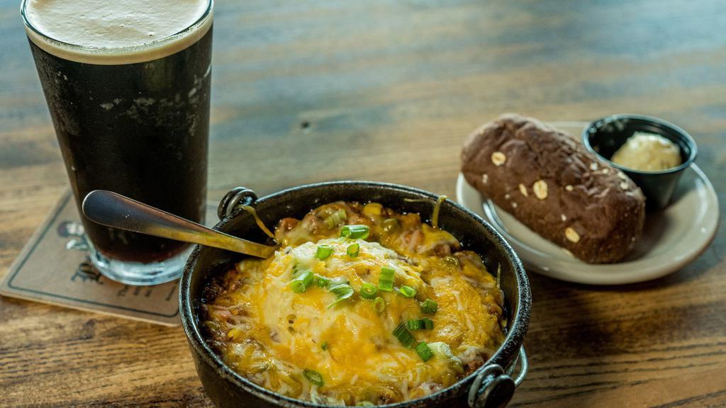 Shepherd'S Pie · Ground beef, peas, corn, carrots, onion, garlic, rosemary and thyme topped with champ potatoes, melted jack-cheddar cheese and green onion. Served with a rustic roll and honey butter.