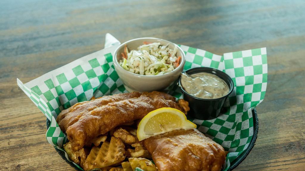 Fibber Flanagan'S Fish & Chips · Ale battered cod golden fried and accompanied by waffle fries and coleslaw. Served with lemon, malt vinegar and lemon-dill tartar sauce.