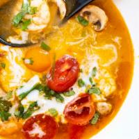 Tom Yum Goong · Hot and spicy broth with shrimp, tomatoes and mushrooms.