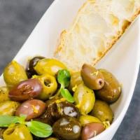 Olives · Selection of our Spanish olives with garlic, lemon and orange zest
