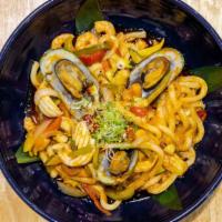 Yaki Udon (볶음우동) · Sautéed wheat flour noodle with seafood or chicken and vegetables.