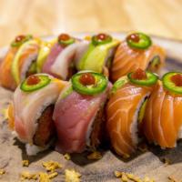 Triple Connection · Spicy tuna, tempura flake rolled, topped with tuna, salmon, yellow tail, avocado, jalapeño a...