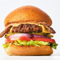 Ziggy Burger · Grilled burger, organic tempeh bac'n, provolone cheese & special sauce, lettuce, tomato, oni...