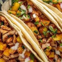 Al Pastor Taco (3 Pcs) · Marinated pork with grilled pineapple and onions. Tacos topped with fresh onions and cilantr...