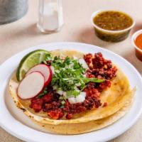 Chorizo Taco (3 Pcs) · Traditional Mexican sausage. Tacos topped with fresh onions and cilantro, garnish with a lim...