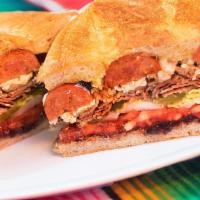 Chorizo Torta · Mexican sausage Traditional Mexican sandwich, served on a telera toasted bread, coated with ...