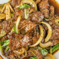 Black Pepper Beef · Sliced beef sautéed with onions, mushrooms, scallions in black pepper sauce.