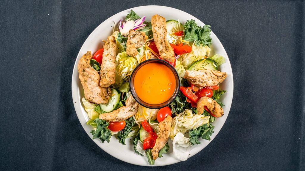 Grilled Chicken Salad · Tender grilled chicken breast, fresh mixed salad greens, carrots, tomatoes, onions, peppers, cucumbers and shredded parmesan and cheddar cheese.