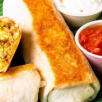 Grilled Breakfast Burrito · Whoa! This burrito is stuffed with scrambled eggs, sausage, cheese, jalapenos, and onion rol...