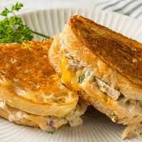 Tuna Melt Sandwich · Classic tuna salad with melted cheddar and sliced tomato on your choice of bread.