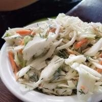 Coleslaw · Shredded cabbage and carrots in a creamy mayo dressing.