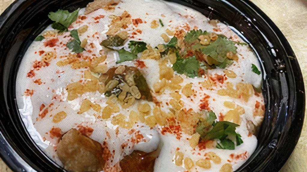 Delhi Dahi Bhalla Chaat · Indian dish. Lentil fritters topped with yogurt tangy tamarind and mint chutney.