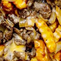 Cheesesteak Fries · A generous basket of our crinkle-cut fries topped with a healthy serving of our texas ribeye...