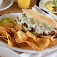Prime Rib Philly · With green peppers, onions and swiss cheese on a grilled roll with garlic aioli.