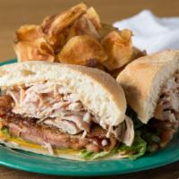 West Clubber · Chosen by the elite. House-smoked turkey, sliced and piled high with grinders candied bacon,...