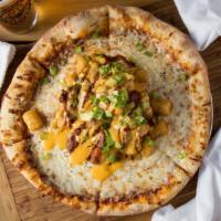 World Famous Chili Bomb · Tots, chili, cheez-whiz and scallions on the middle of your pie!.