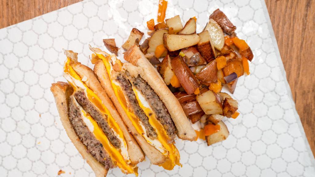 Single Stacked Breakfast Sandwich · Served w/home fries. Choice of fried or scrambled eggs, choice of bacon, sausage or scrapple, choice of cheese Swiss, American or provolone. Served on choice of white or marble rye bread.