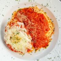 Chicken Parmigiana Plate · Breaded chicken breast topped with tomato sauce and mozzarella served over a  bed of spaghet...