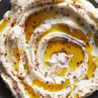 Labneh · Strained low fat yogurt  mixed w/mint & touch of olive oil