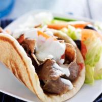 Authentic Pork Gyro · Fresh marinated and seasoned pork wrapped in pita with tomatoes, onions, tzatziki (cucumber ...