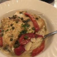 Flounder Francese · Fresh flounder fillet prepared in an egg-battered with roasted peppers and capers in a lemon...