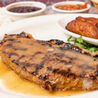 Carne Asada · Grilled New York steak marinated in our special seasoning and topped with brown garlic sauce...