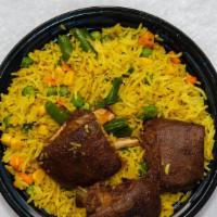 Fried Rice And Goat-Meat · Fried Rice with Goat meat comes with coleslaw and peppered sauce