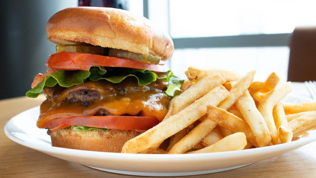 The Burger On 16 · Two grilled fresh ground beef patties, cheddar cheese, park sauce, lettuce, tomato, and pickles. Served with french fries.