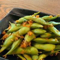 Spicy Edamame · Edamame tossed in hot sauce with garlic and dashi sauce.