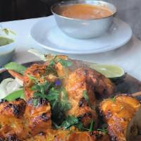 Chicken Tikka · Tender boneless chicken, marinated & grilled on skewers in a clay pit oven.