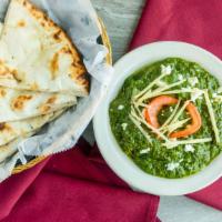 Palak Paneer · Homemade cheese prepared in a delish spinach sauce.